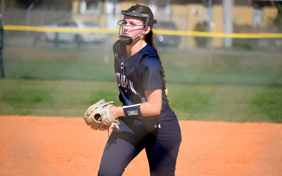 Sophomore pitcher Madi Cunningham starts her windup versus Chatham College at the DiamondPLEX in Winter Haven, Florida during the first no-hitter of her collegiate career. Photo by Christine Fox