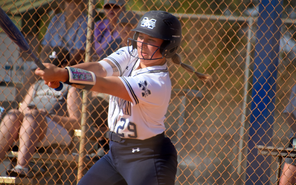Junior catcher Mya Zettlemoyer connects on a hit in the Greyhounds game versus Bridgewater (Va.) College at DiamondPLEX in Winter Haven, Florida as part of the PFX Spring Games. Photo by Christine Fox