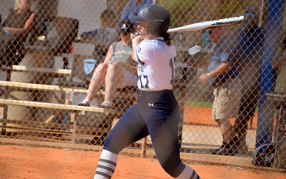Freshman Angelina Marino follows through on a swing in a game versus Bridgewater (Va.) College at the PFX Spring Games in Florida. Photo by Christine Fox