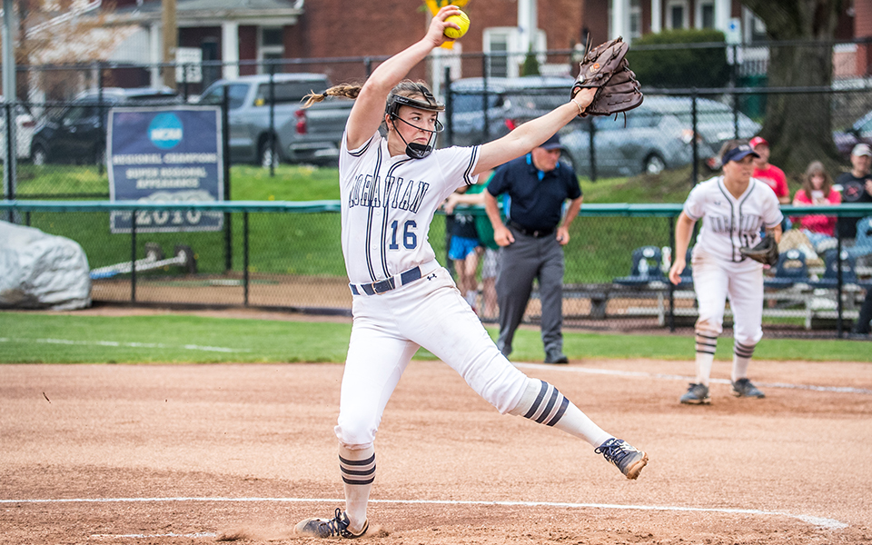 Freshman pitcher Sarah DeStefano delivers a pitch versus The Catholic University of America at Blue & Grey Field. Photo by Cosmic Fox Media / Matthew Levine '11