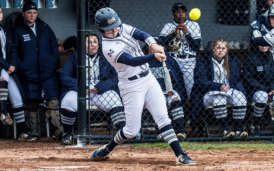 Junior first baseman Lindsey Gawrys hits the ball in the first game of a doubleheader versus Elizabethtown College at Blue & Grey Field. Photo by Cosmic Fox Media / Matthew Levine '11