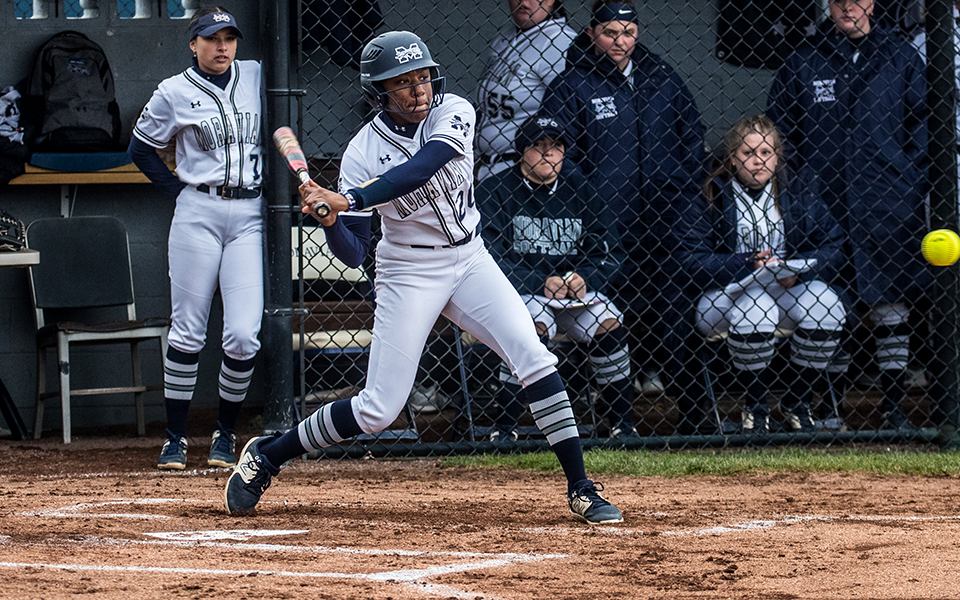 Senior second baseman Ajala Elmore swings at a pitch in the opening game of a doubleheader versus Susquehanna University at Blue & Grey Field. Photo by Cosmic Fox Media / Matthew Levine '11