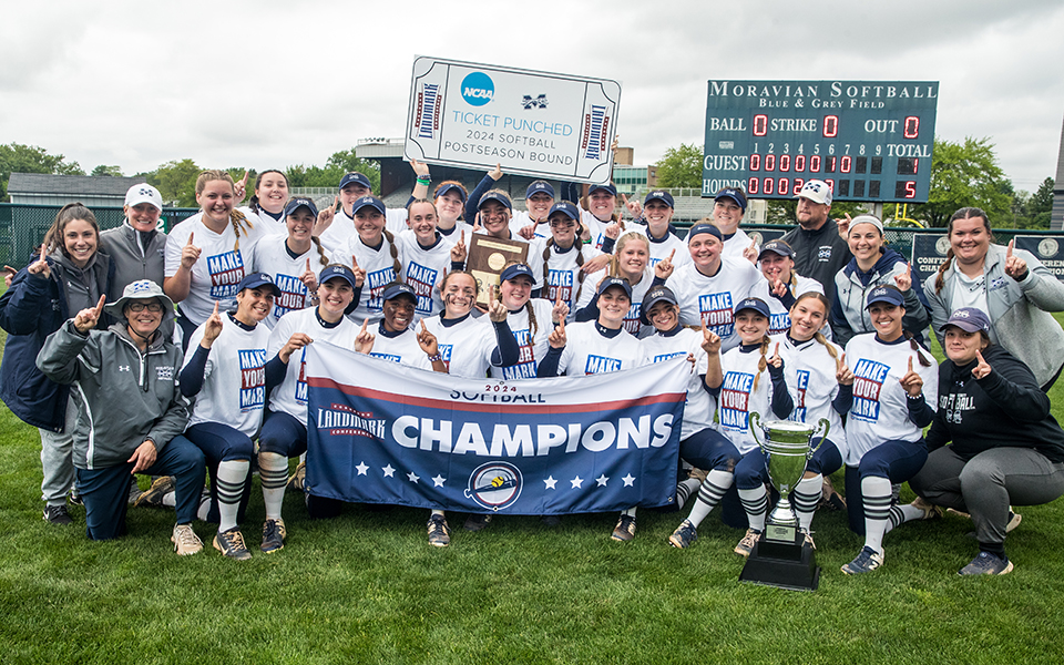 The Greyhounds pose with the 2024 Landmark Conference Championship trophy after winning the title game at Blue & Grey Field to earn an automatic berth to the NCAA Division III Regional, which will also be at Blue & Grey Field. Photo by Cosmic Fox Media / Matthew Levine '11