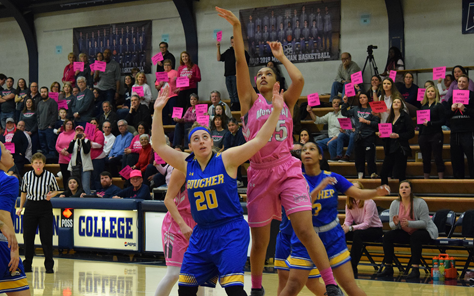 Junior forward Nadine Ewald takes a jumper in the lane during the first half versus Goucher College in annual Play4Kay game.