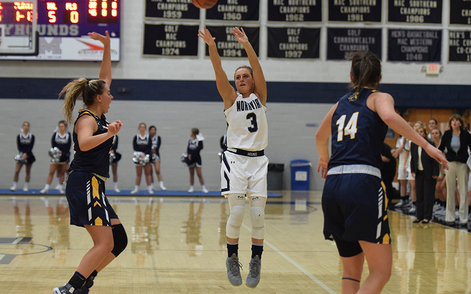 Senior Maddie Capuano shoots a three-pointer versus TCNJ in Johnston Hall.
