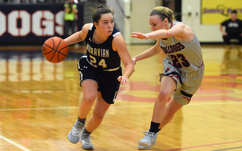 Freshman guard Morgan Amy dribbles on the offensive end in the first half at DeSales University.