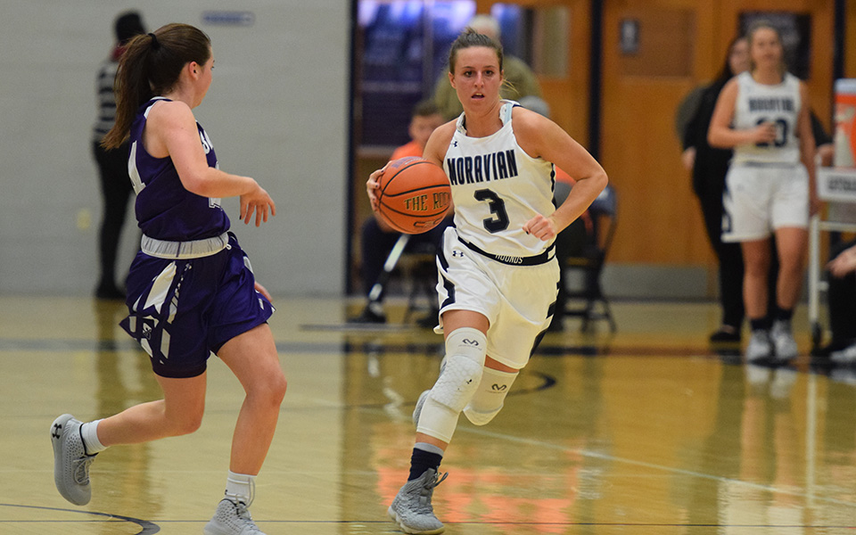 Senior guard Maddie Capuano brings the ball up the court during the first half of a game versus The University of Scranton in Johnston Hall.