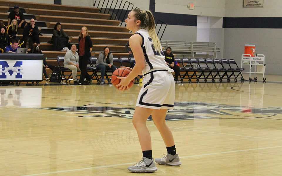 Freshman guard Jackie Kelly sets up the offense in the second half versus Goucher College in Johnston Hall.