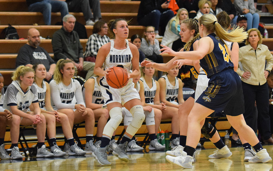 Senior guard Maddie Capuano pulls up to shoot in front of the Moravian bench late in the fourth quarter versus Lycoming College in Johnston Hall.