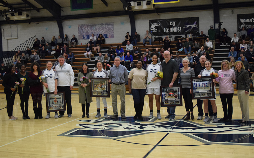 The women's basketball program's senior players and managers with their families before tip-off versus Elizabethtown College in Johnston Hall.