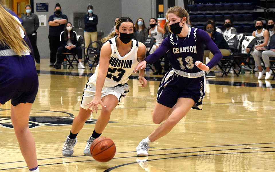 Madison Amy '23 dribbles towards the basket in the first half versus The University of Scranton in Johnston Hall.