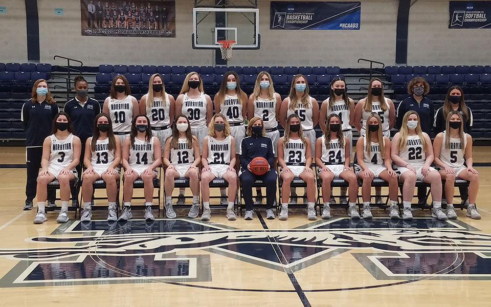 2020-21 moravian women's basketball team photo in johnston hall with team wearing masks