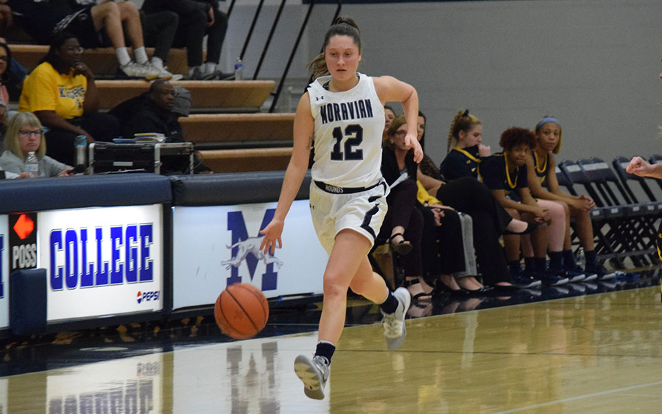 Sarah Donati '21 dribbles up the court in Johnston Hall in a game versus Neumann University in January 2020.