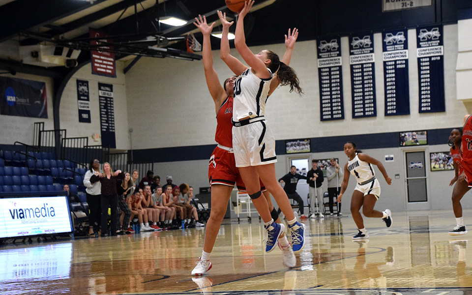 Graduate student forward Tessa Zamolyi puts up the winning buzzer-beating lay-up as the Greyhounds defeated Albright College, 66-64, in Johnston Hall to open the 2022-23 season. Photo by Avery Saladino '24