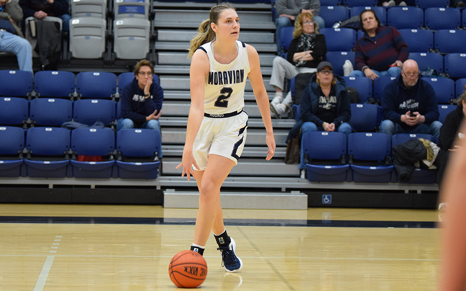 Graduate student forward Kayla Yoegel looks to set up the offense in the second half versus Juniata College in Johnston Hall earlier this season.