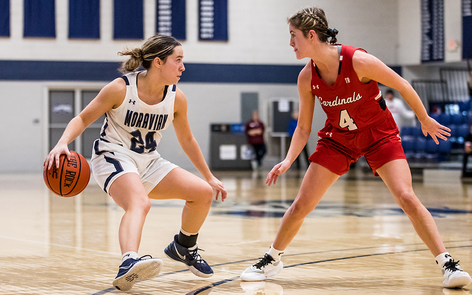 Senior guard Morgan Amy dribbles during the second half of a game versus The Catholic University of America in Johnston Hall earlier this season. Photo by Cosmic Fox Media / Matthew Levine '11