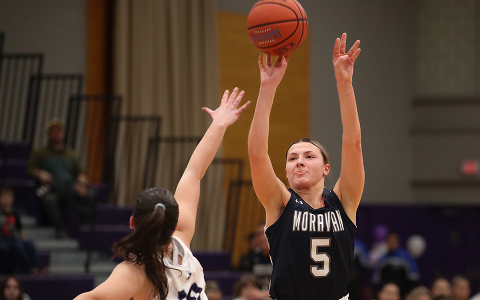 Senior forward Emily Markowski shoots a three-pointer in the Landmark Conference Semifinal game at No. 3 The University of Scranton. Photo by Double Eagle Photography / Timothy R. Dougherty