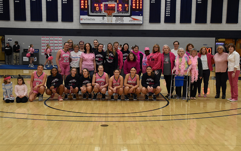 The Greyhounds and cancer survivors before Moravian played Susquehanna University in Johnston Hall on February 18 in the 2023 Play4Kay game. Photo by Christian Jancsarics '23