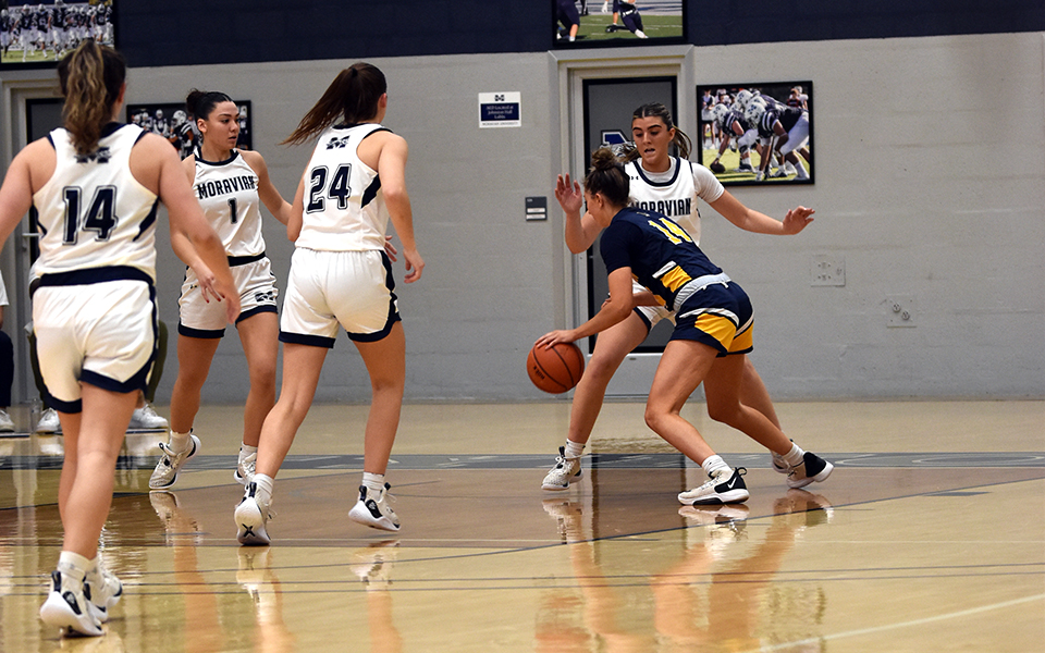 The Greyhounds on defense in the second half versus Neumann University in the 20th Steel Club Classic in Johnston Hall. Photo by Carly Pyatt '25