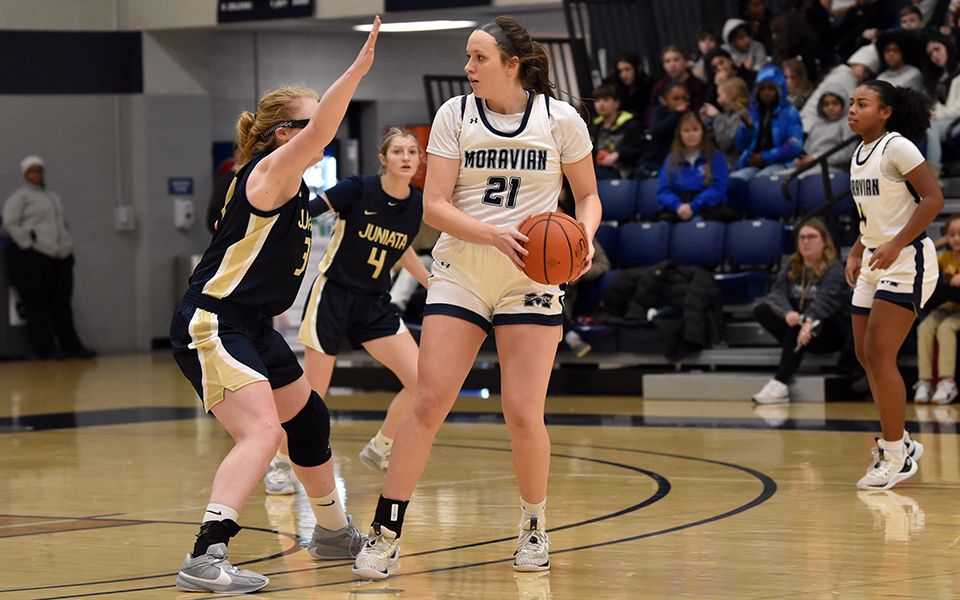 Freshman center Grace Steffen looks to pass during the first half of a game versus Juniata College in Johnston Hall.