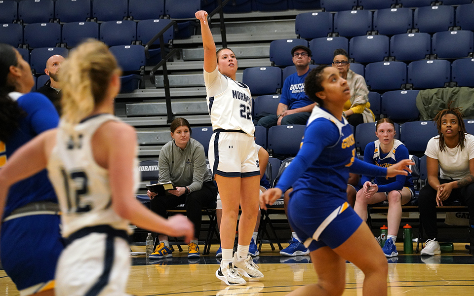 Sophomore guard Juliana Vassallo watches a three-pointer head for the basket early in the second quarter versus Goucher College in Johnston Hall. Photo by Avery Saladino '24