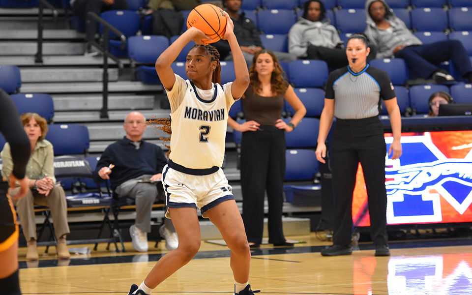 Junior forward Kania Day looks to shoot a jumper in the second half versus Goucher College in Johnston Hall. Photo by Carly Pyatt '25