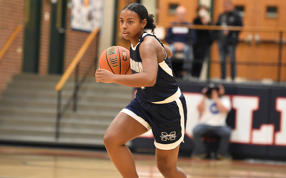 Junior guard Jayda Cartagena brings the ball up the court in the first half at DeSales University. Photo by Christine Fox