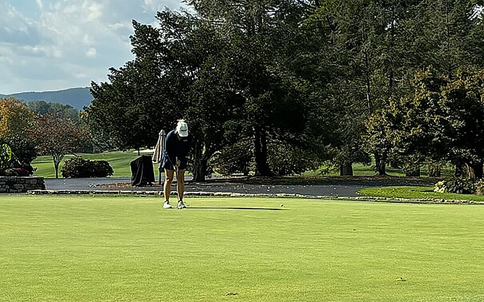 Sophomore Heidi Wegscheider putts during her medalist round at Lehigh Country Club.