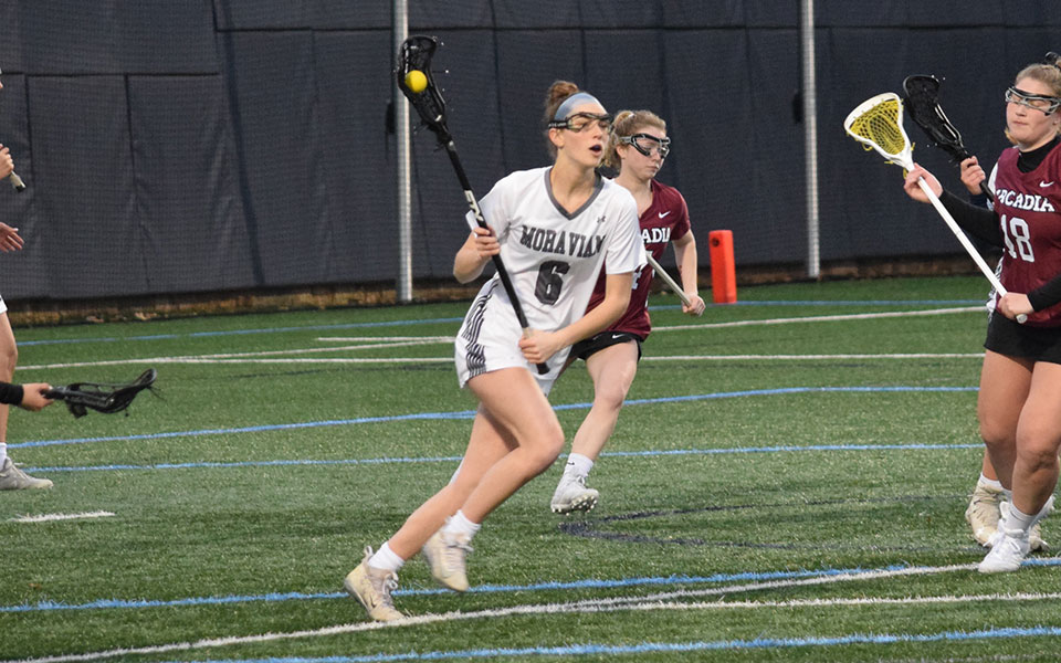 Sophomore Lindsey Strohl looks to move upfield after a ground ball versus Arcadia University on John Makuvek Field.