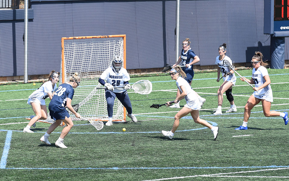 The Greyhounds defense goes for a loose ball after a save by junior goalie Rylee Soltis versus Juniata College on John Makuvek Field. Photo by Skyler Edwards '25