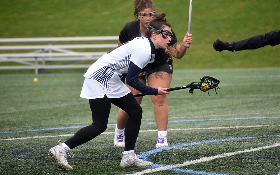 Junior attack Jackie Salvatore gets set to take a free position shot during the first quarter versus Goucher College on John Makuvek Field. Photo by Marissa Williams '26