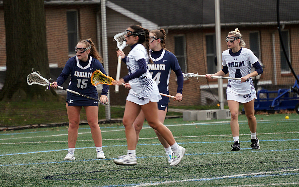 Junior Isabella Ziccardi and freshman Reagan Reiner watch a goal from sophomore Gianna Lotito in the first quarter versus Juniata College on John Makuvek Field. Photo by Avery Saladino '24