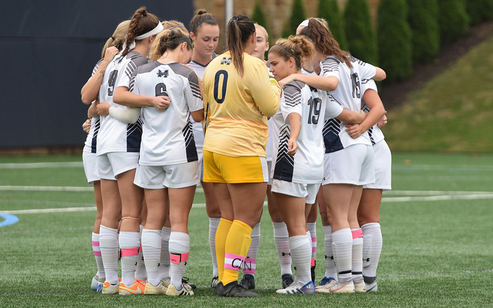 The Greyhounds huddle before the start of a Landmark Conference contest versus The University of Scranton on John Makuvek Field during the 2018 season.