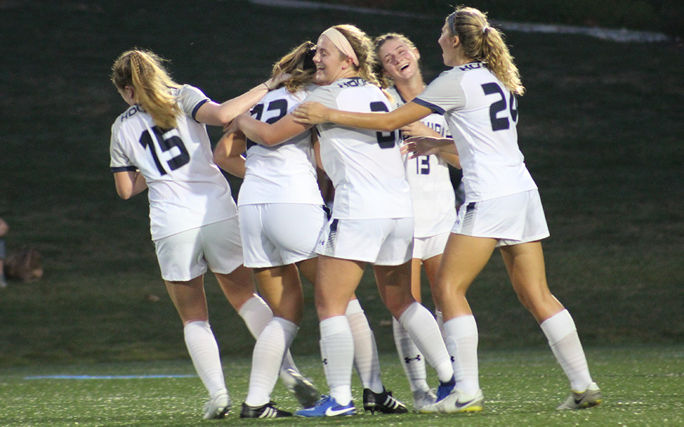 The Greyhounds celebrate with junior defender Sara Cassel (22) after she scored on a long free kick in the 26th minute of Moravian's shutout win over rival Muhlenberg College.
