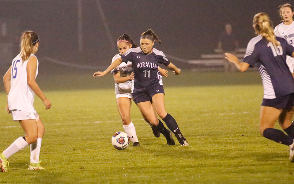 Senior Morgan Covart plays the ball during a match at Elizabethtown College. Photo courtesy of Elizabethtown College Athletic Communications