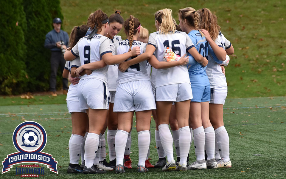 The Greyhounds huddle before their match with Drew University on John Makuvek Field. Photo by Nadia Hassanali.