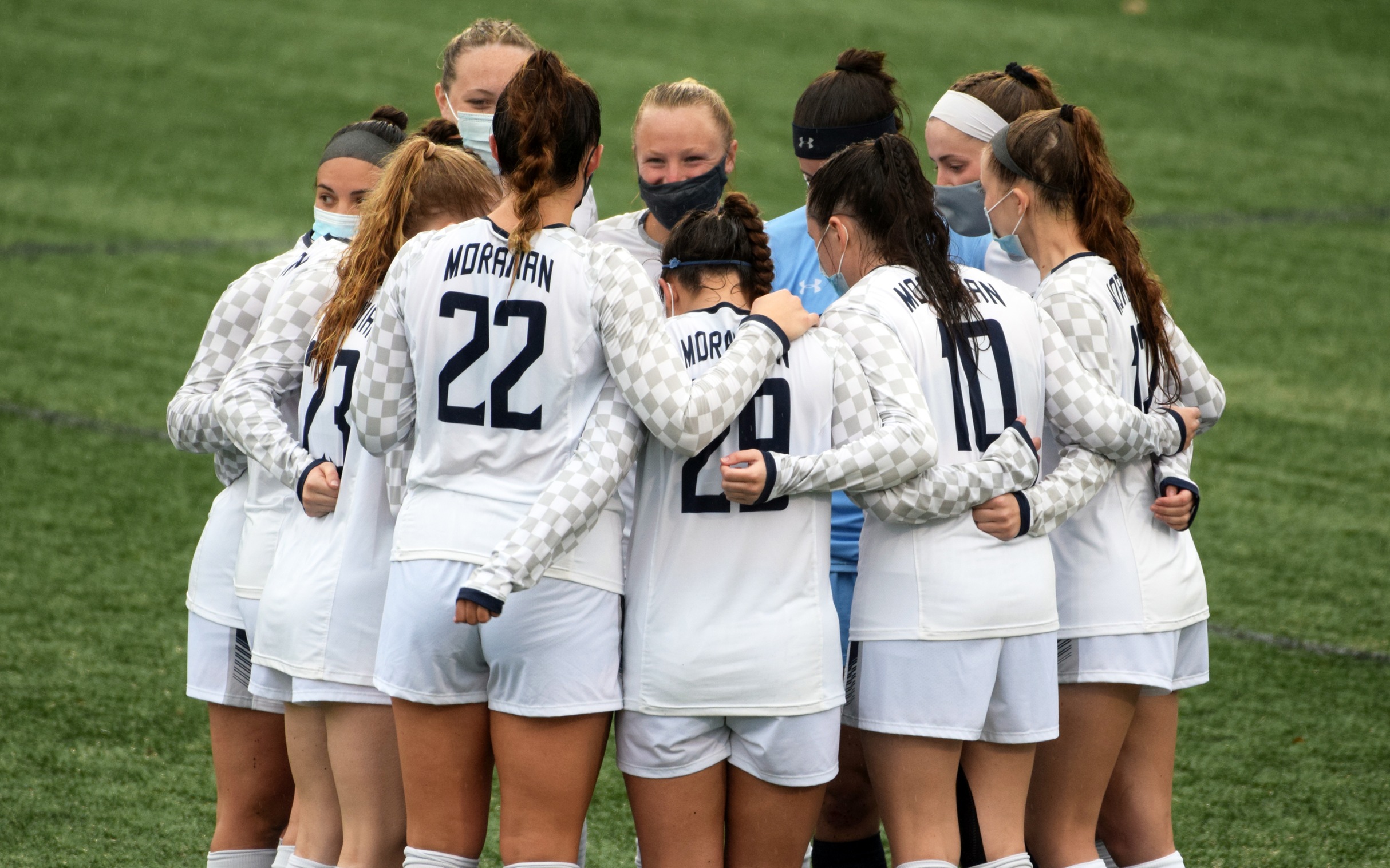 Moravian huddles before a match during the 2021 non-traditional season.