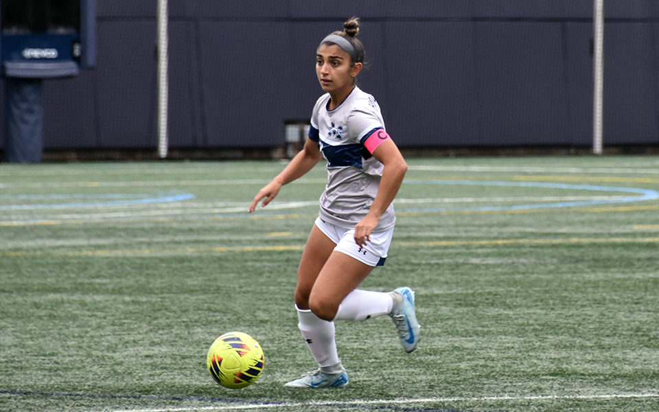 Senior defender Hailey Scaff looks to pass versus Eastern University on John Makuvek Field. Photo by Grace Nelson '26