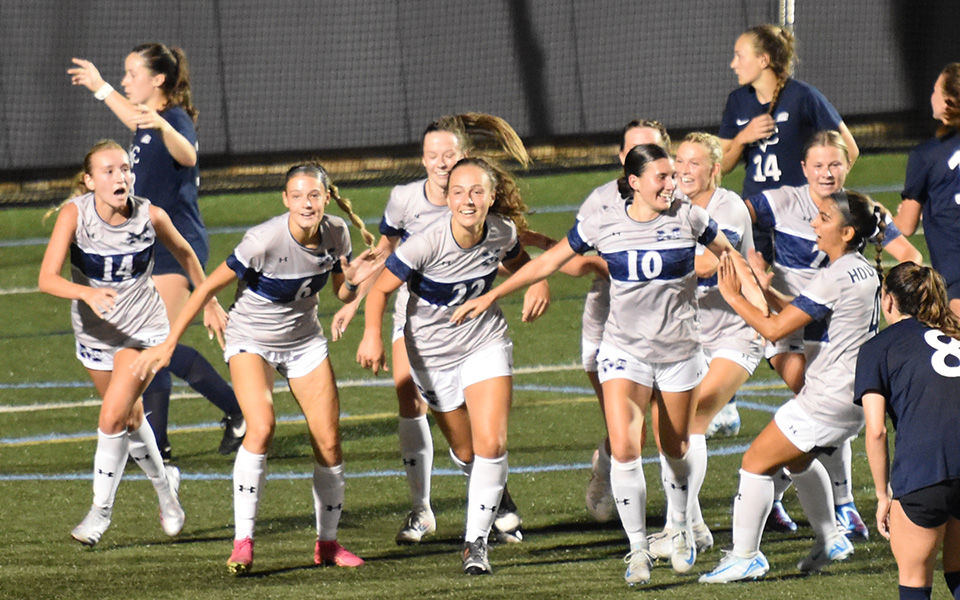 The Greyhounds celebrate Carly Pyatt's goal in the 74th minute to defeat Lebanon Valley College on John Makuvek Field to start the 2024 season. Photo by Marissa Williams '26