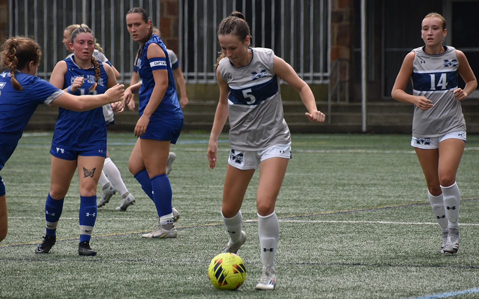 Junior forward Elliot Rupp plays a ball forward in the second half versus Colby-Sawyer (N.H.) College on John Makuvek Field. Photo by Marissa Williams '26