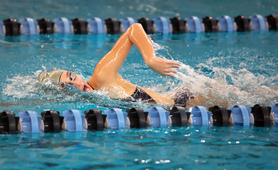 Freshman Catie Lovett competes in the opening session at the Cougar Splash Invitational. Photo by Timothy R. Dougherty / Double Eagle Photography