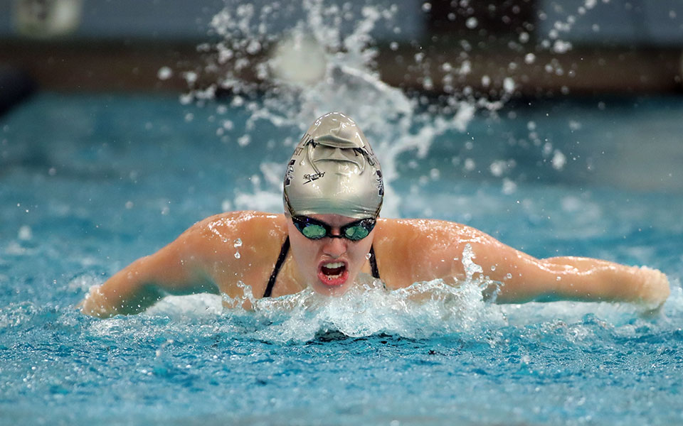 Junior Jaelyn Mitchell competes in the opening session of the Cougar Splash Invitational hosted by Misericordia University. Photo by Timothy R. Dougherty / Double Eagle Photography