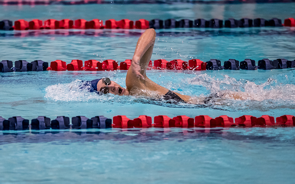 Senior Sydney Steere swims in a dual meet with Immaculata University at Liberty High School during the 2021-22 inaugural season. Photo by Cosmic Fox Media / Matthew Levine '11