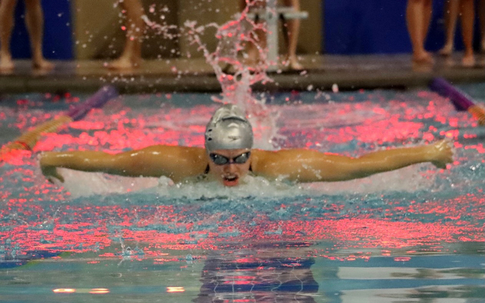 Senior Jaelyn Mitchell competes in the 200-yard individual medley at Misericordia University. Photo by Marissa Werner '23