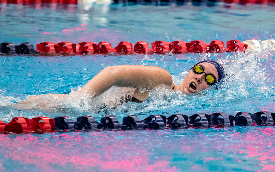 Sophomore Catie Lovett swims in a dual meet with Immaculata University at Liberty High School during the 2021-22 season. Photo by Cosmic Fox Media / Matthew Levine '11