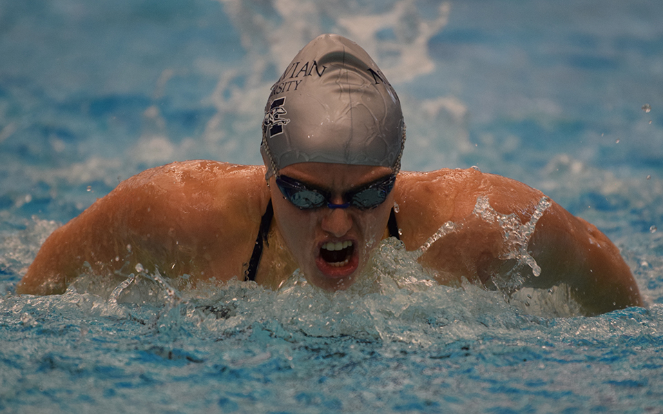 Senior Jaelyn Mitchell swims in the 100-yard butterfly in a double dual meet with Goucher College and Susquehanna University at Liberty High School.
