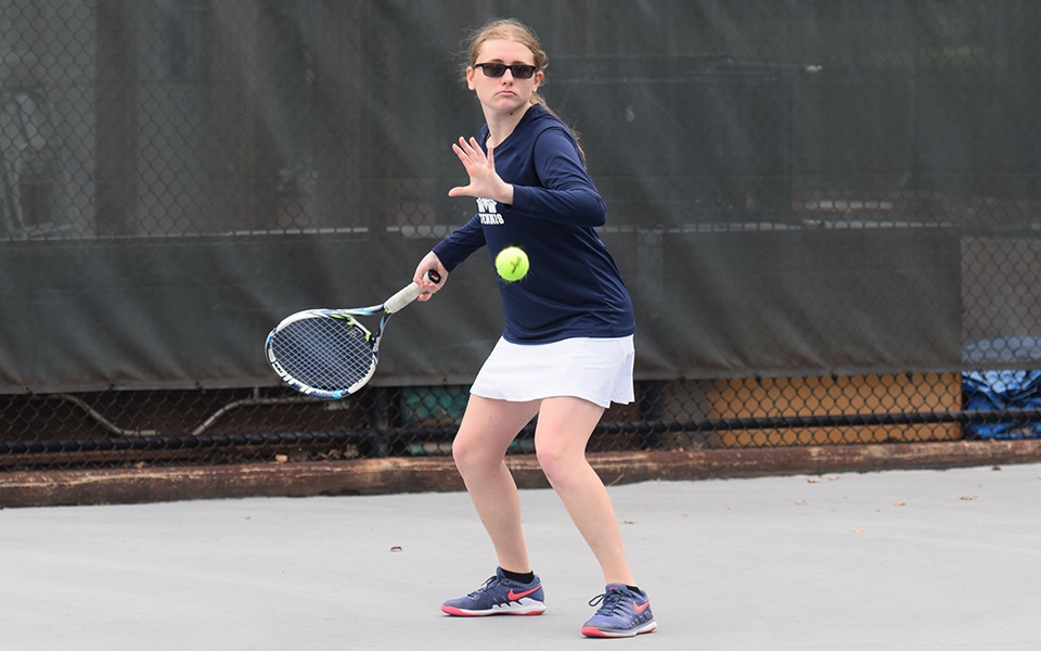 Sophomore Destiny George returns a shot in doubles action versus Cedar Crest College on Hoffman Courts during the fall 2018 season.