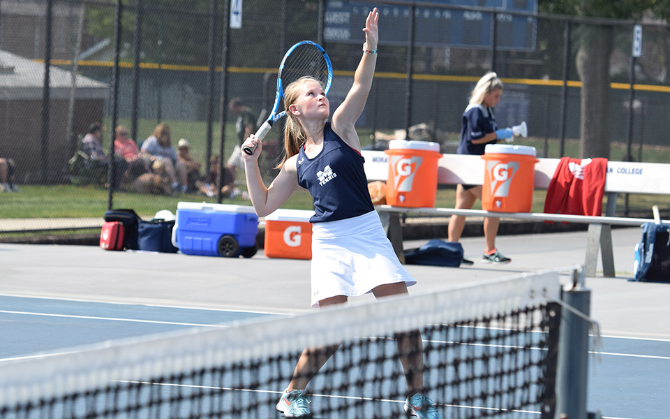 Julianne Cassady gets ready to hit a shot at the net in doubles action versus DeSales University at Hoffman Courts.