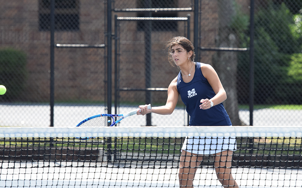 Cristina Merone returns a shot at the net versus Immaculata University at Hoffman Courts.
