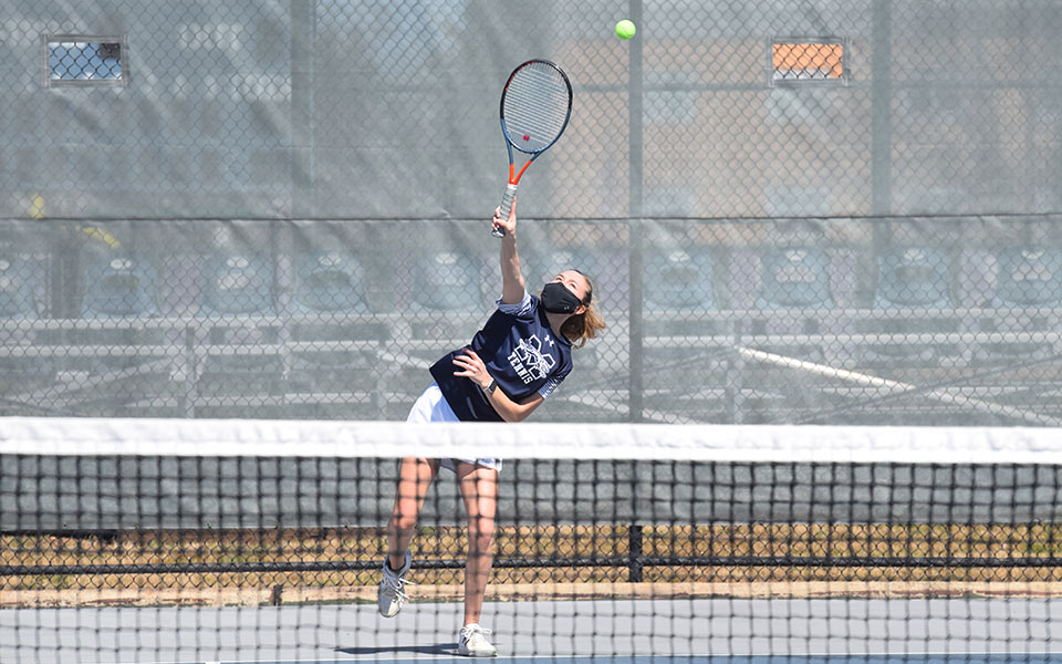 Mary Angle '21 serves during doubles action versus Immaculata University at Hoffman Courts.